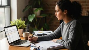 Small business owner managing payroll tax compliance at a cozy desk